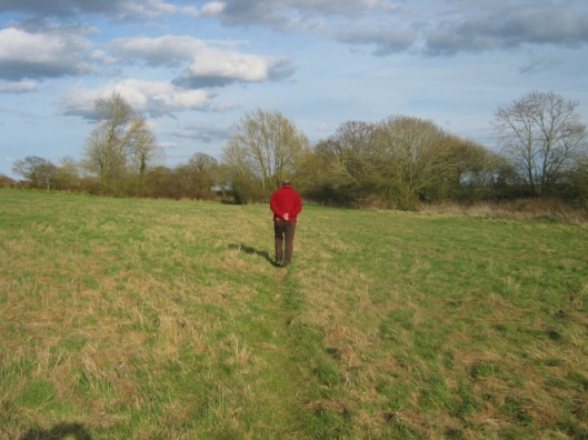 Richard walking across the field